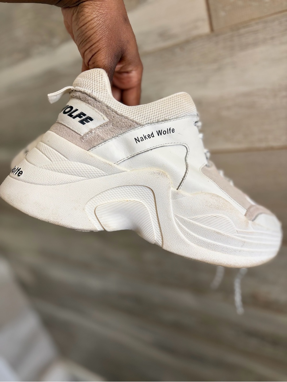 Naked Wolfe Track flatform sneakers w/ a chunky platform sole &- brand lettering